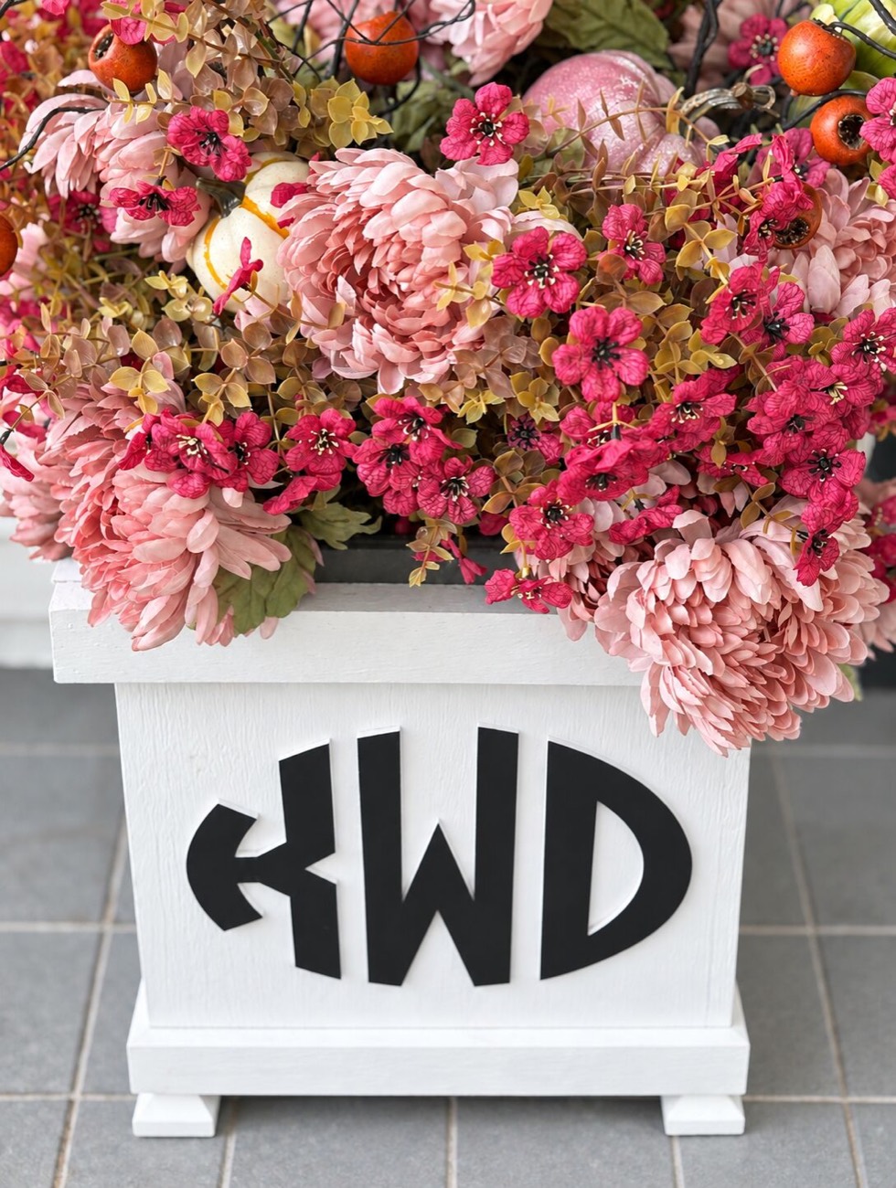 Purple and Pink and Orange Front Porch Decorated With Pumpkins